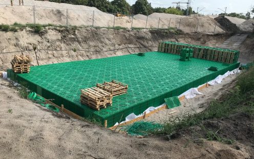 Nearly completed stormwater infiltration tank from Stormbox II crates nearby the railway line | Pipelife