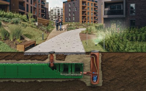 Couple walks over a revela of stormwater attenuation tanks