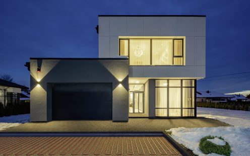 Exterior of luxury private house. Modern cottage at evening.